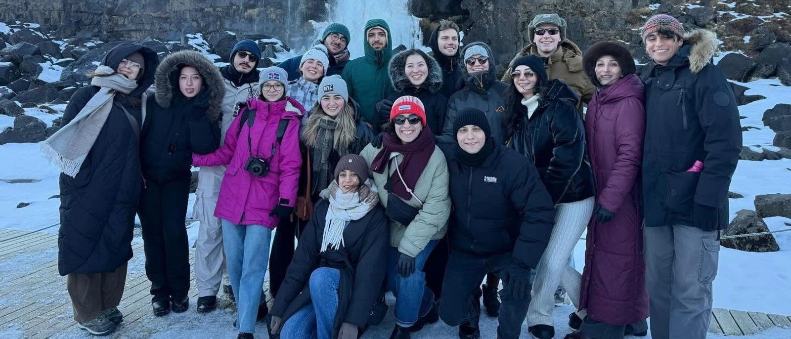 The IceMenia group at a frozen waterfall in Iceland